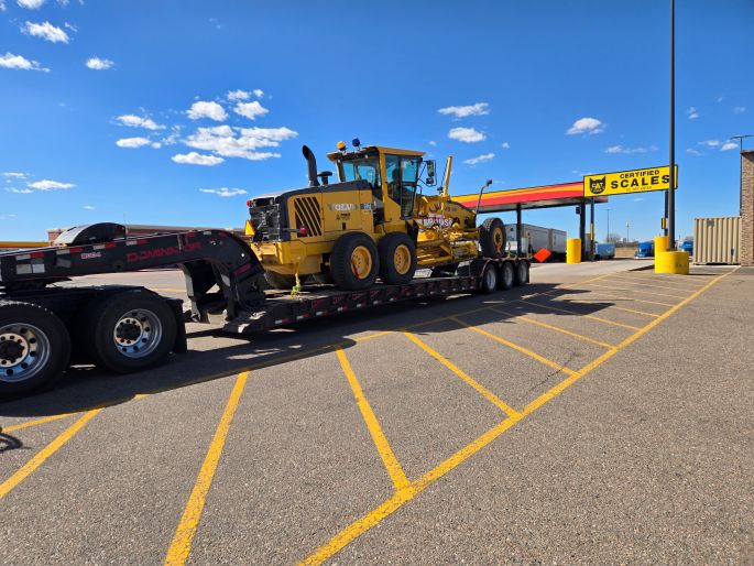 construction equipment transportation services
